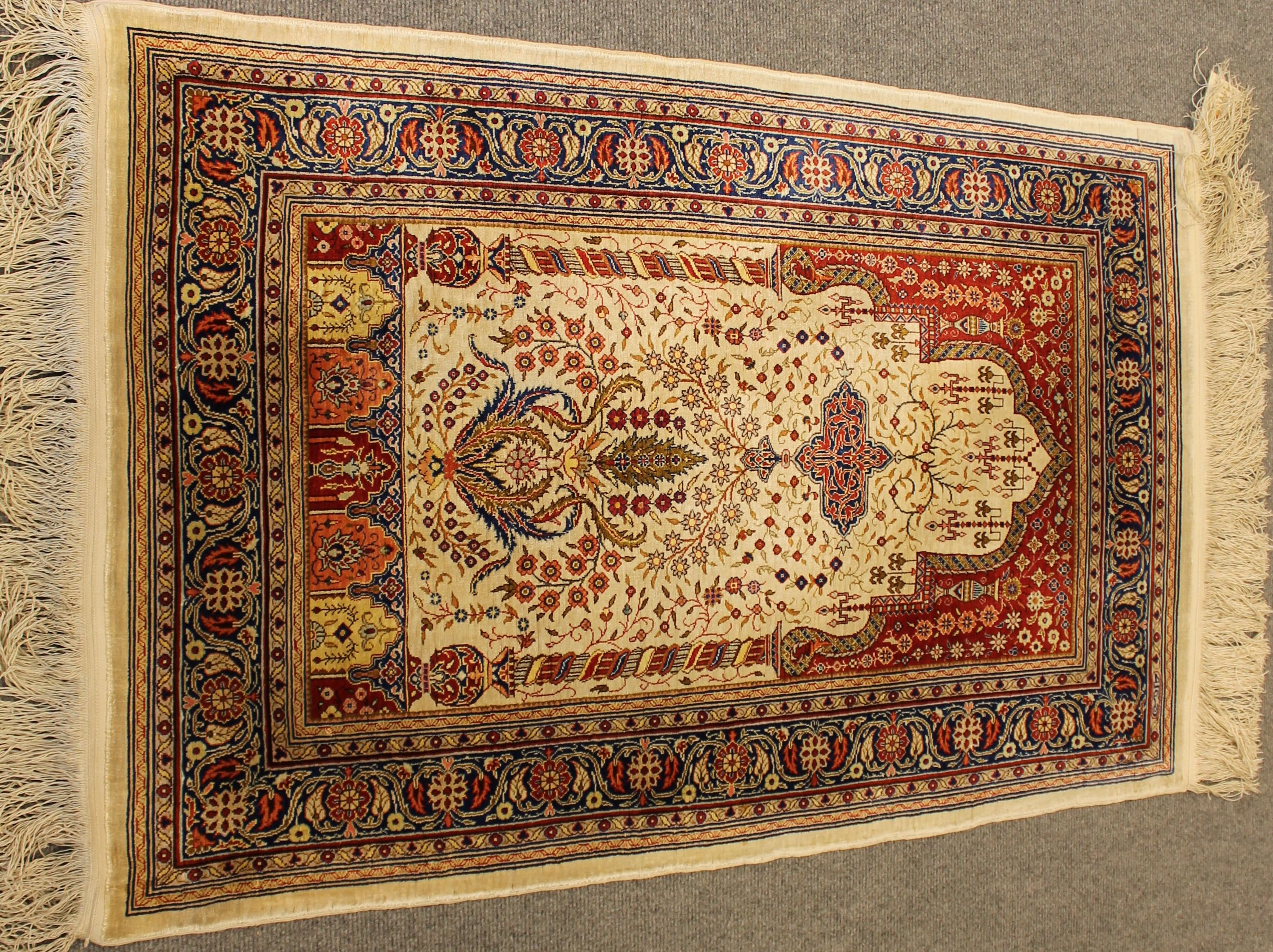 Antique silk Hereke rug