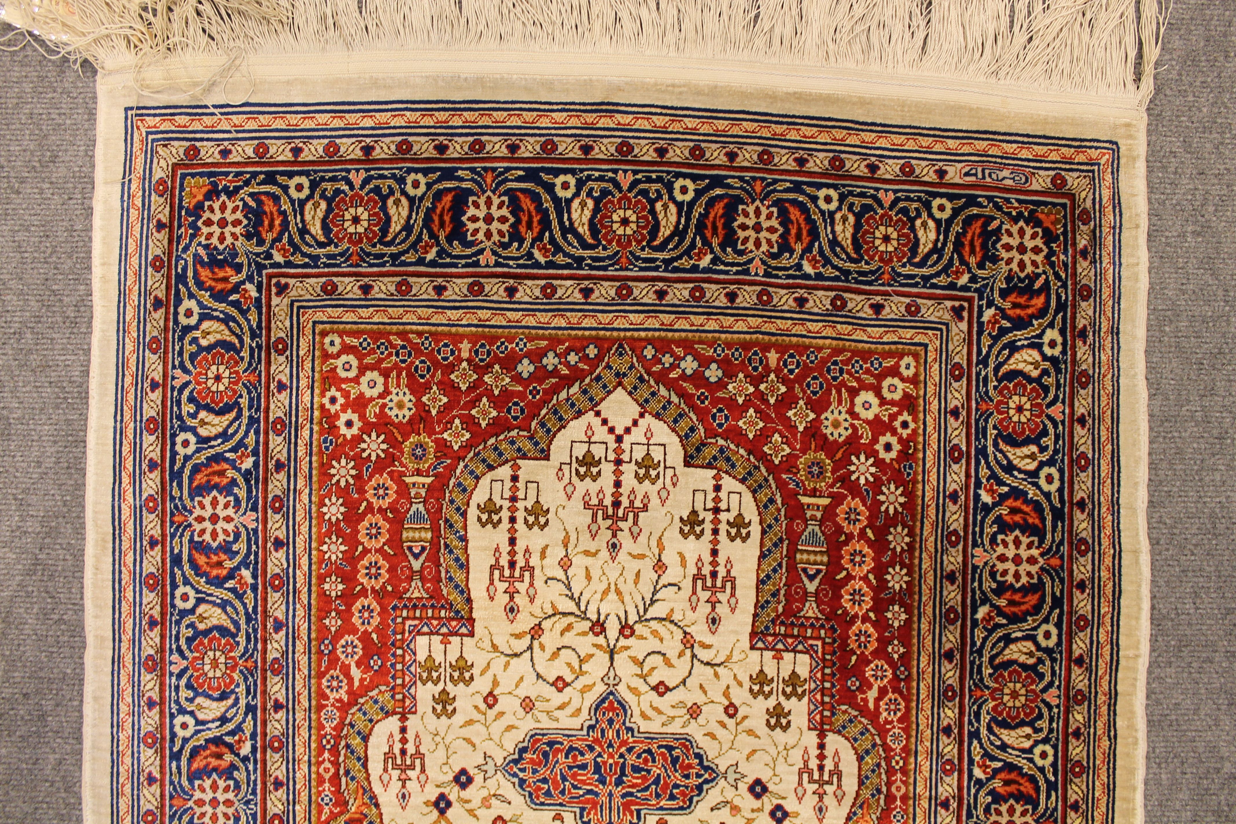 Antique silk Hereke rug