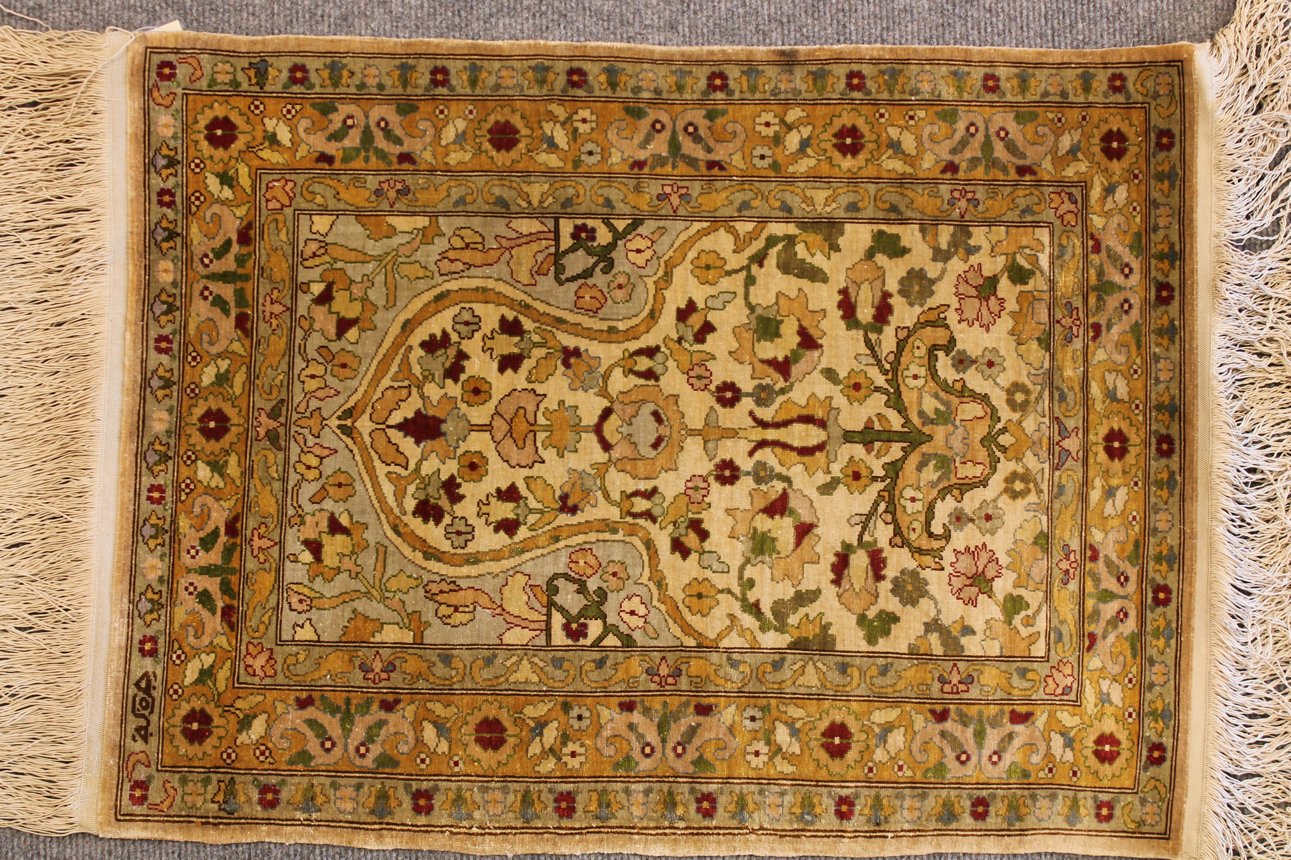 Antique Silk Hereke rug