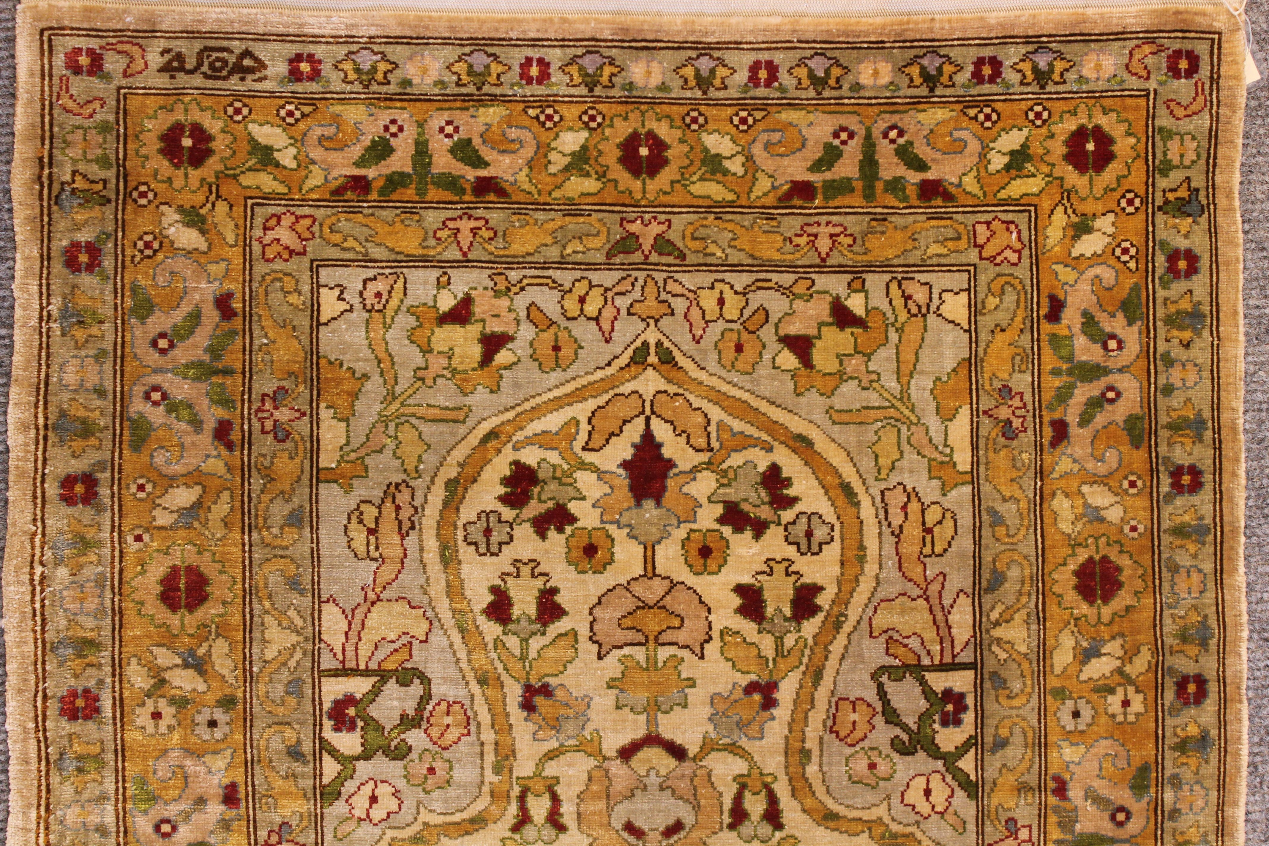 Antique Silk Hereke rug
