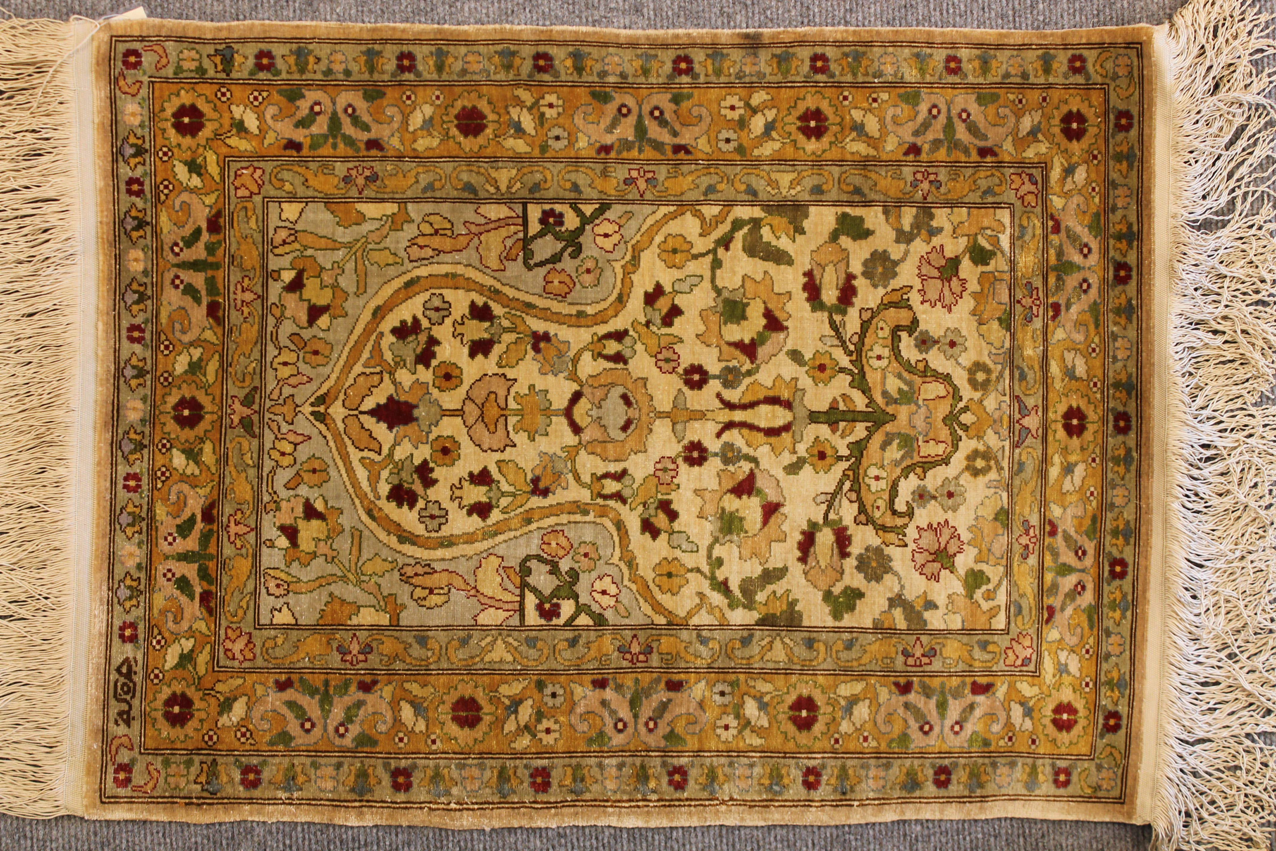 Antique Silk Hereke rug