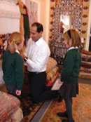 Anas helps schoolchildren weave at The Oriental Rug Gallery ltd