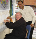 Haslemere Town Hall Clerk Mike O'neil weaves his rug knot