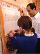 Schoolgirl weaving at The Oriental Rug Gallery Ltd